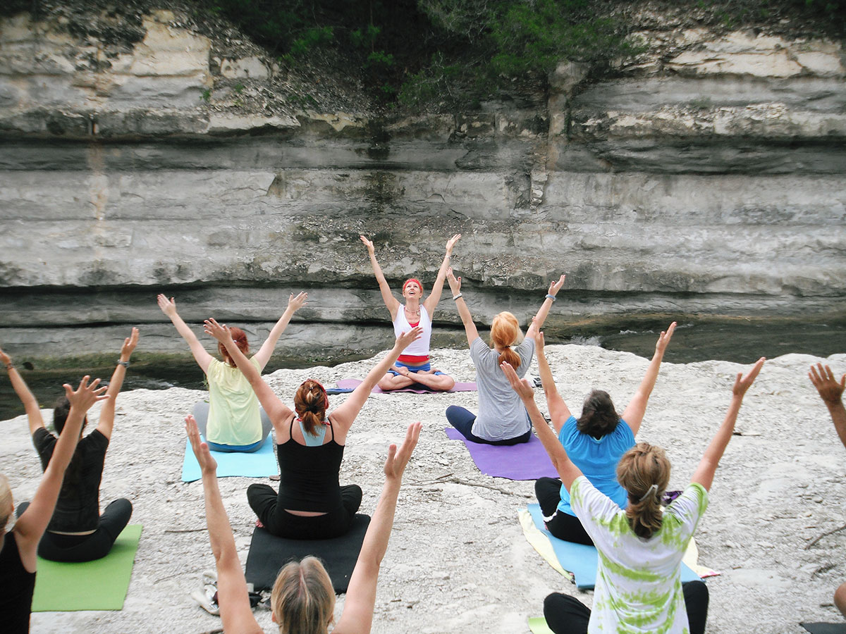 A welcoming group movement class outdoors
